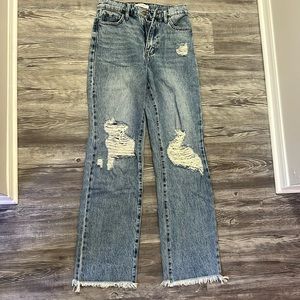 Distressed denim jeans